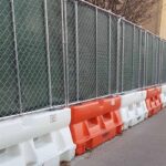 YODOCK Plastic Jersey Barrier with Chain Link Fence Topper Kit in Use